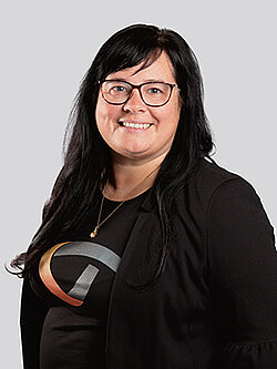 woman with a black shirt and a blazer