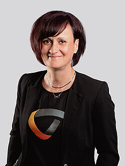 woman with a black shirt and a blazer