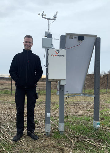 Trainee next to the weather station